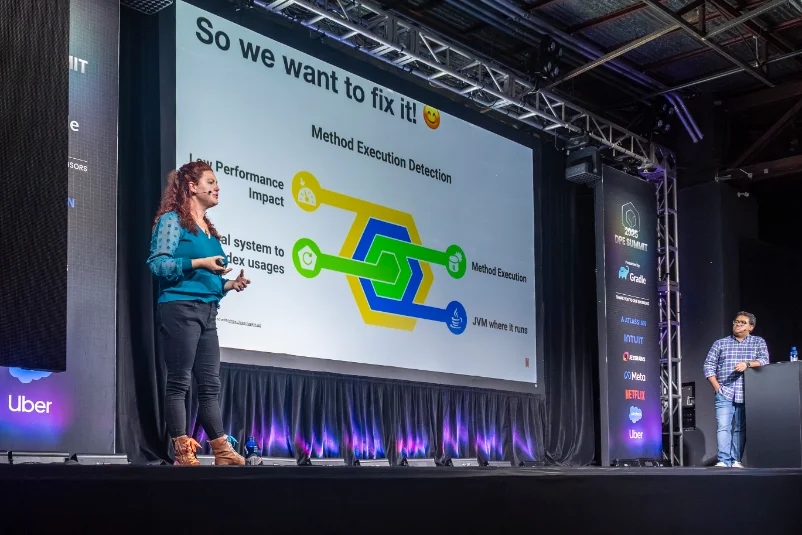Speaker presenting on method execution detection on the DPE Summit 2025 main stage